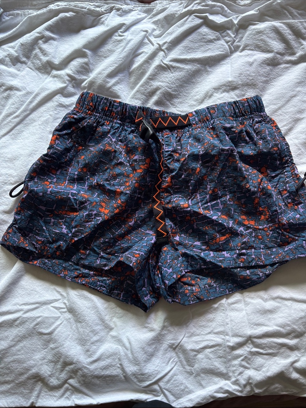 Nike ACG Women’s Printed Athletic Shorts in Navy with Orange Accents